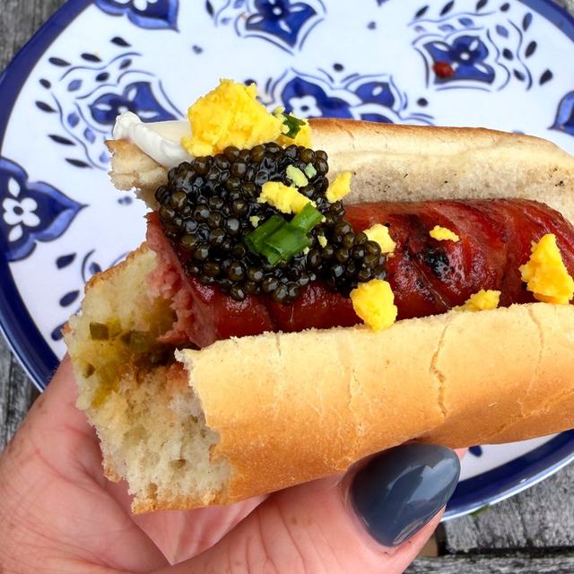 A hot dog topped with caviar